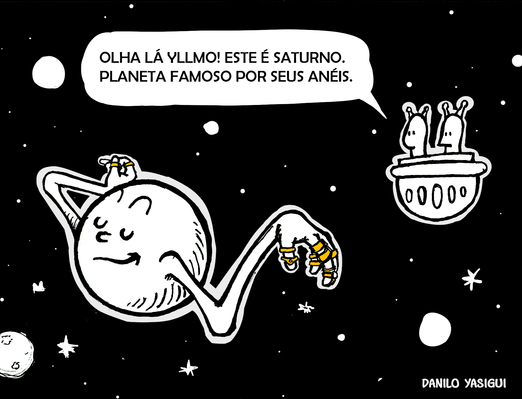 Cartum humorístico mostrando dois alienígenas em uma nave espacial observando o planeta Saturno, que aparece com braços e mãos humanas usando vários anéis dourados nos dedos. Um dos alienígenas diz: "Olha lá Yllmo! Este é Saturno. Planeta famoso por seus anéis."